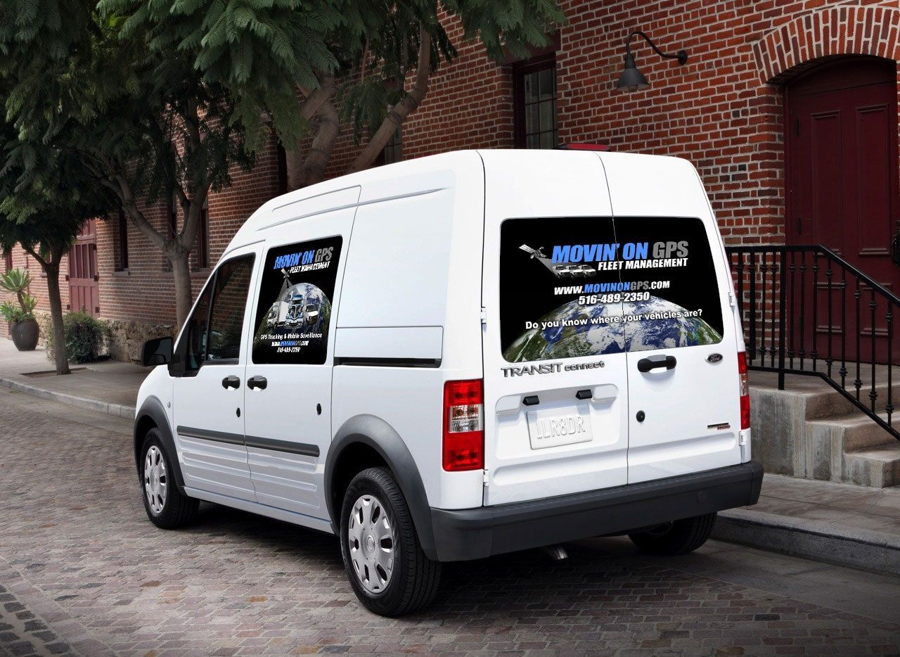 White van parked on street with 