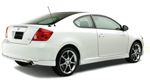 White Scion tC coupe on a white background, rear view.