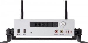 Silver electronic device with antennas, ports, and dial, mounted on a black bracket.