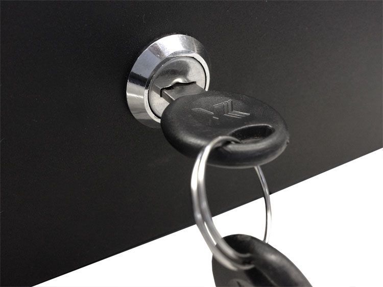 Key inserted in a black cabinet lock, with a key ring and a black key.