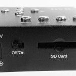 Black device with buttons, an on/off switch, and an SD card slot.