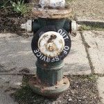 Green and rusty fire hydrant marked