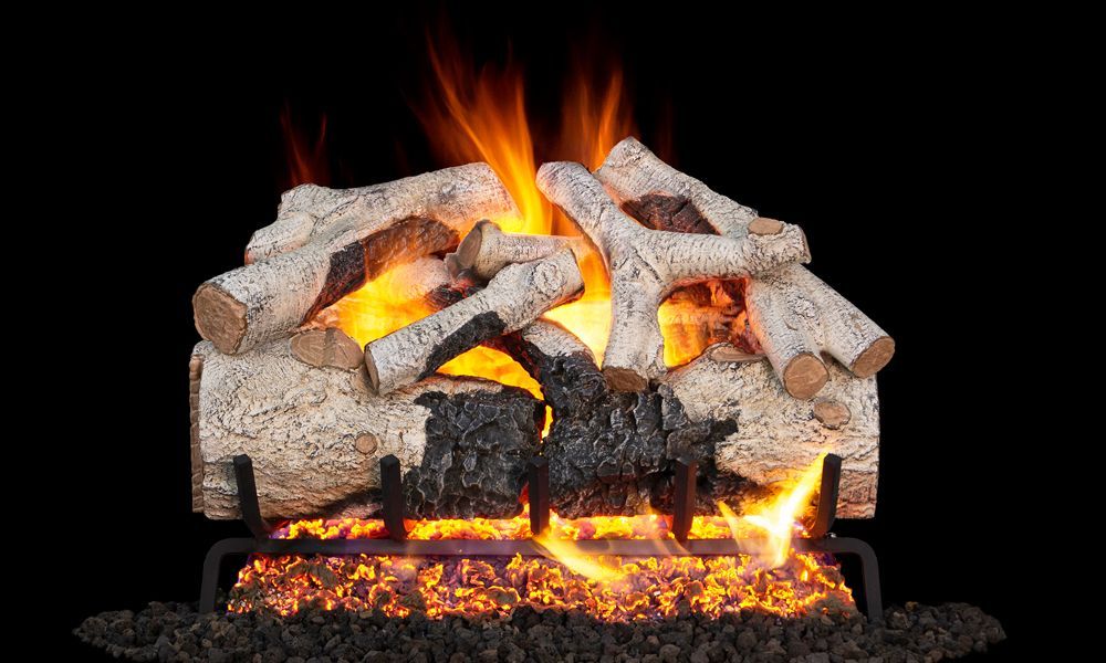 A fireplace filled with logs and fire on a black background.