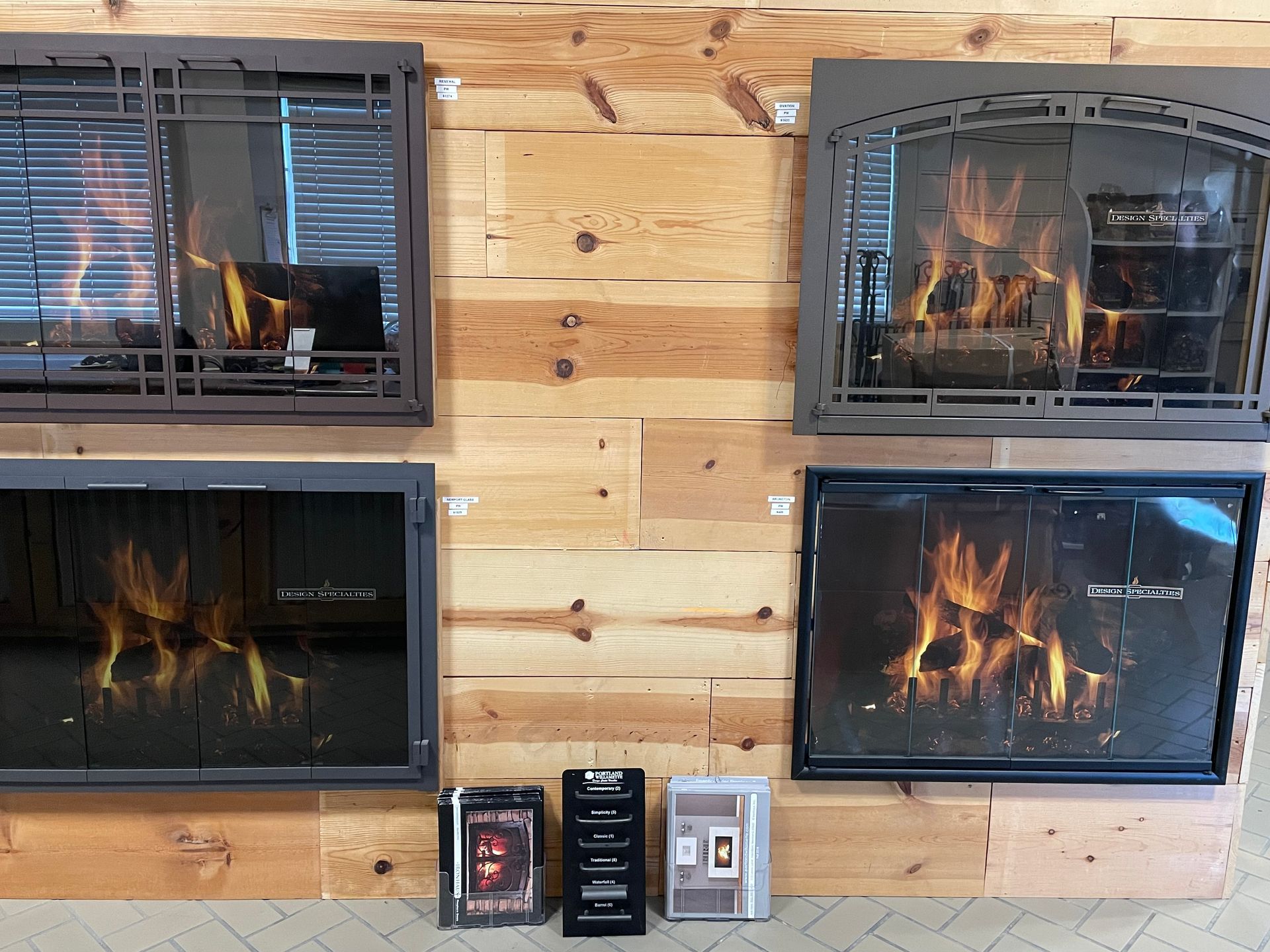 There are many different types of fireplaces on display in this room.