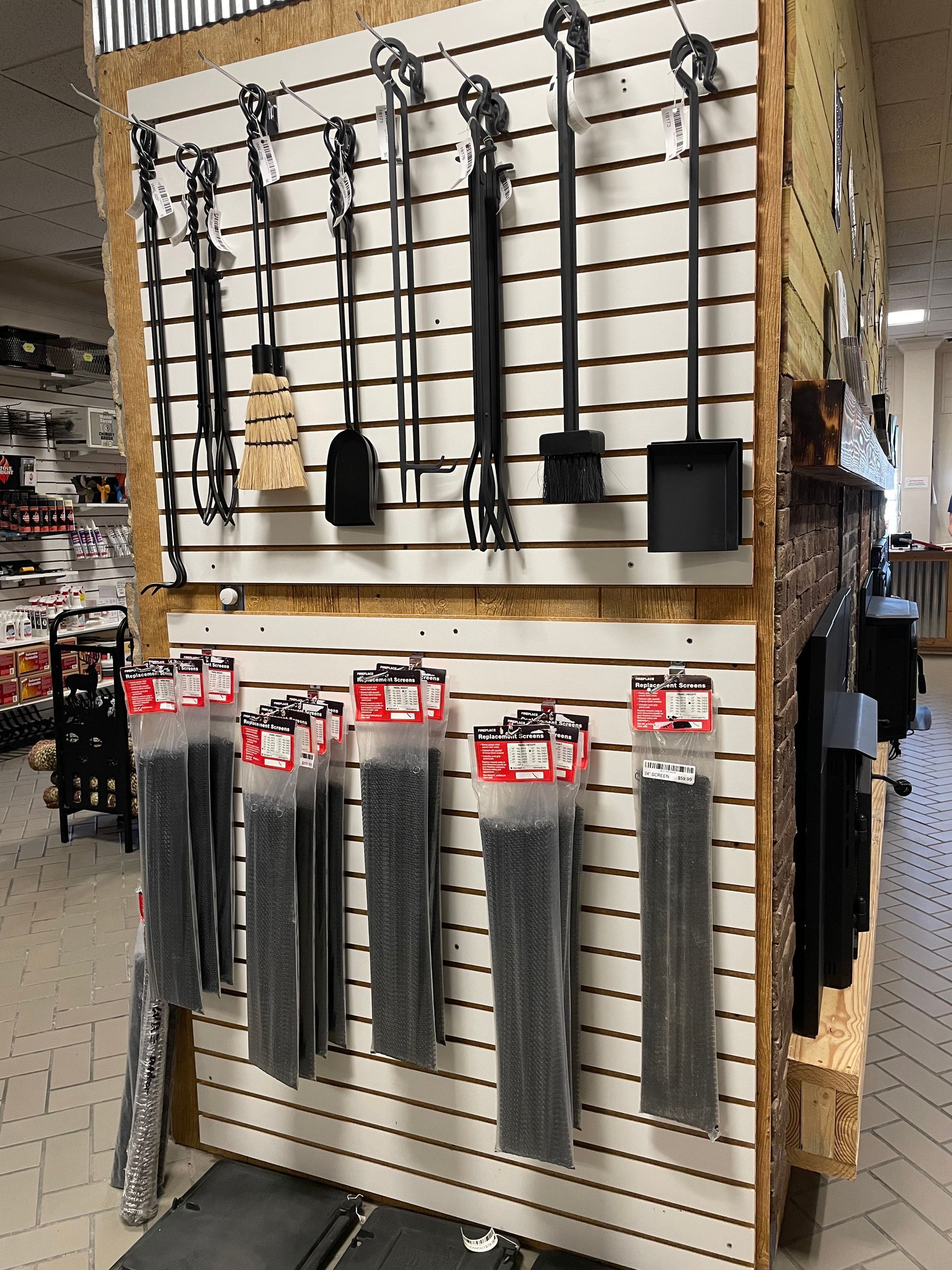 A wall with a bunch of tools hanging on it