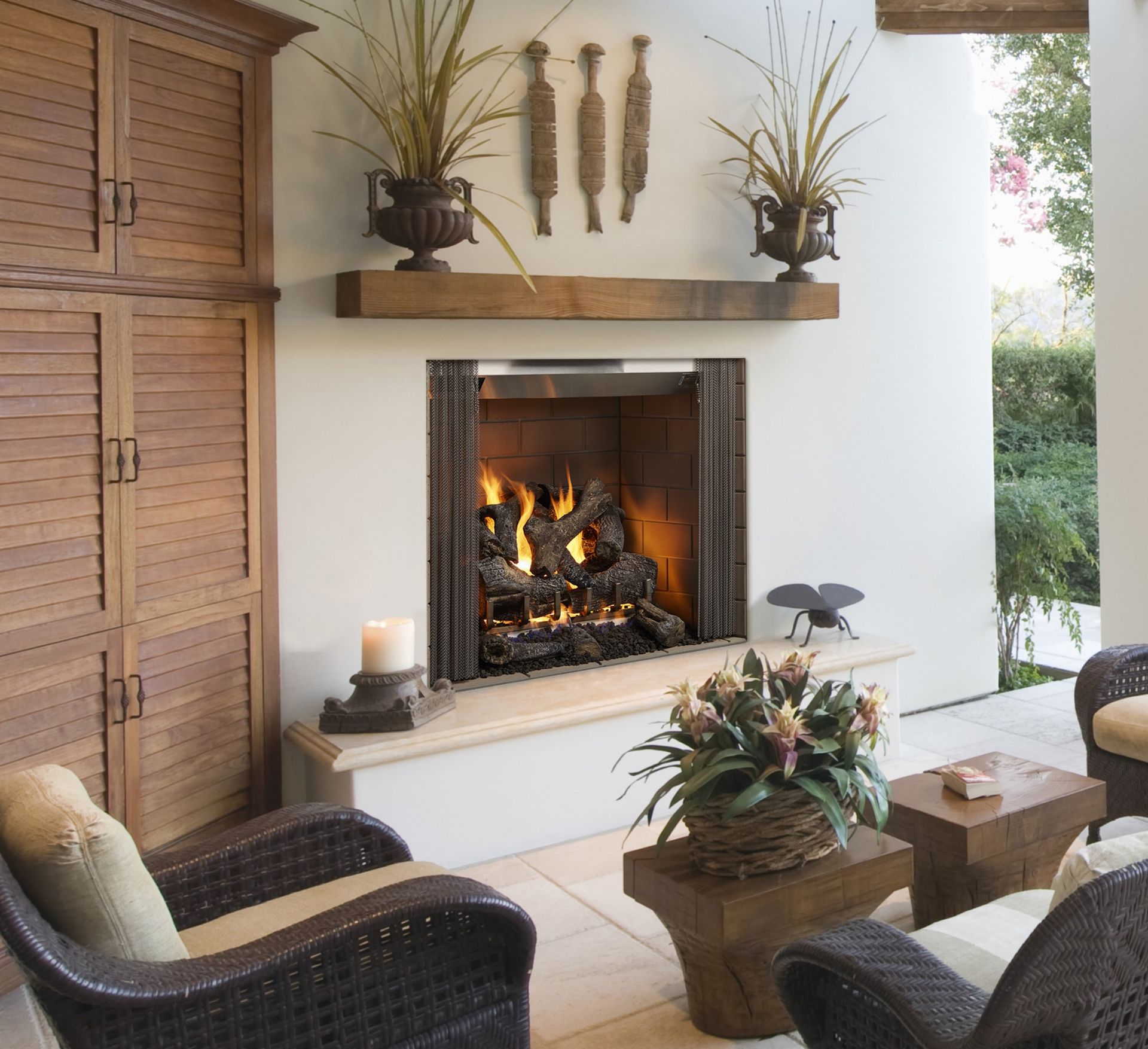 A living room with wicker furniture and a fireplace