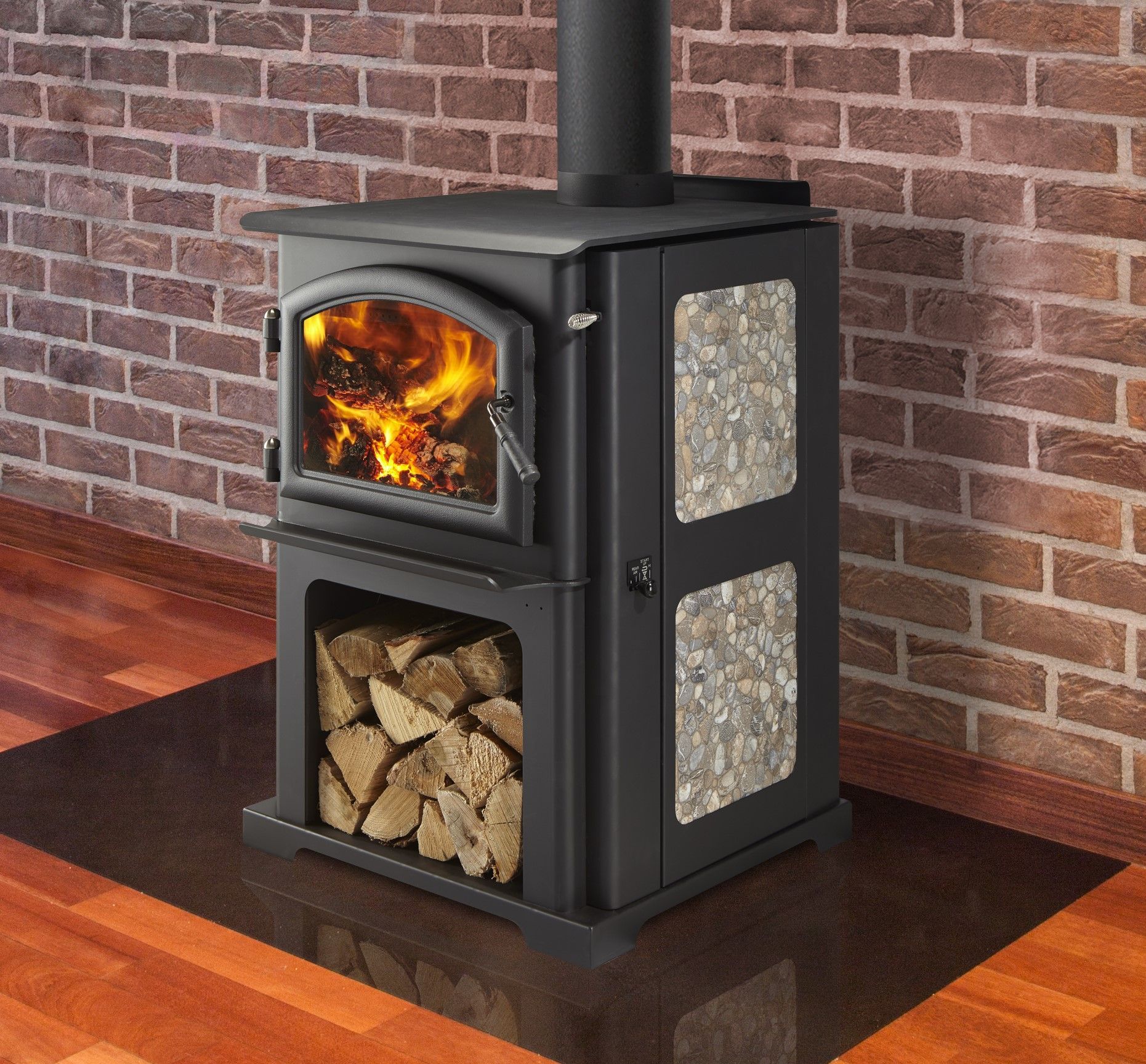 A wood stove is sitting in front of a brick wall