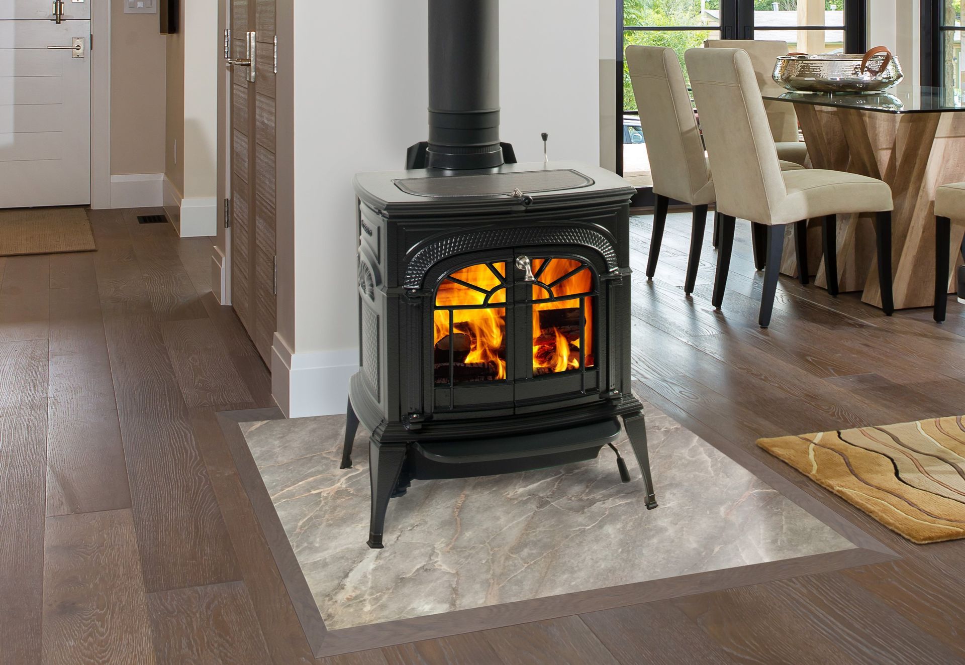 A wood stove is sitting on a tiled floor in a living room.