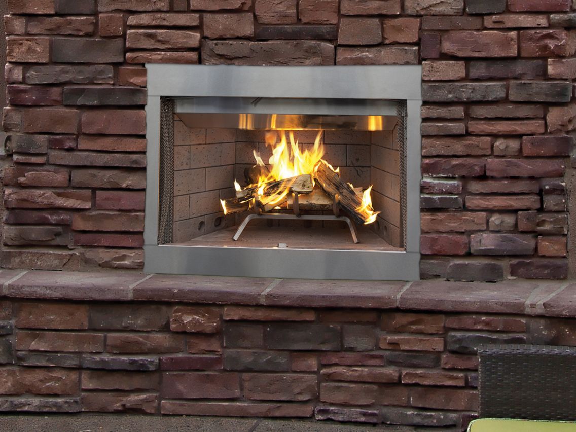 A fireplace is built into a brick wall