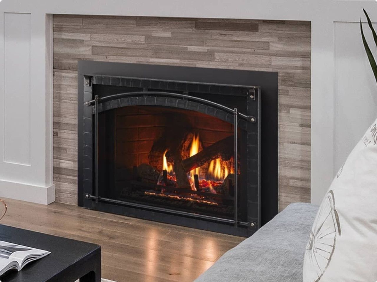 A living room with a fireplace and a couch.