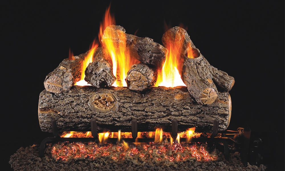 A fireplace made of logs is sitting on top of a pile of dirt.