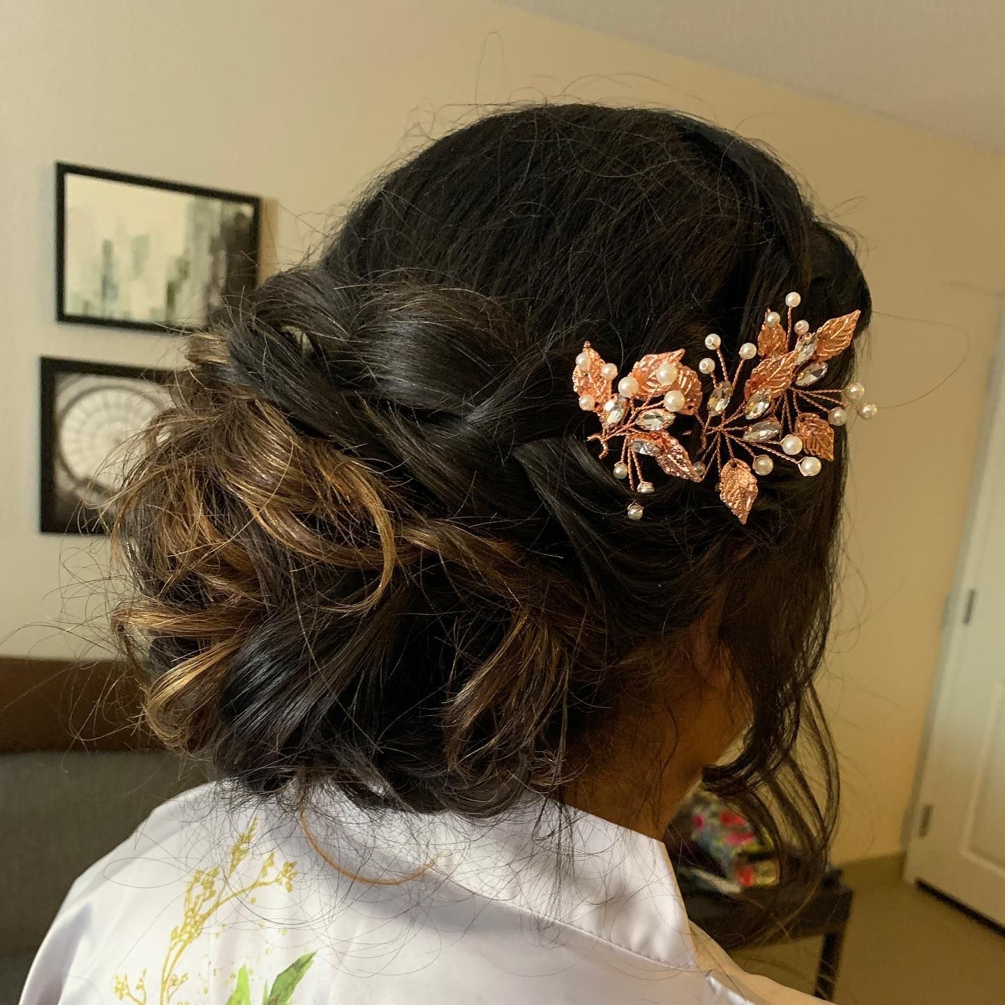 A woman is wearing a hair clip in her hair.