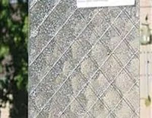 Textured glass panel with a crisscross pattern, likely for privacy or decoration.