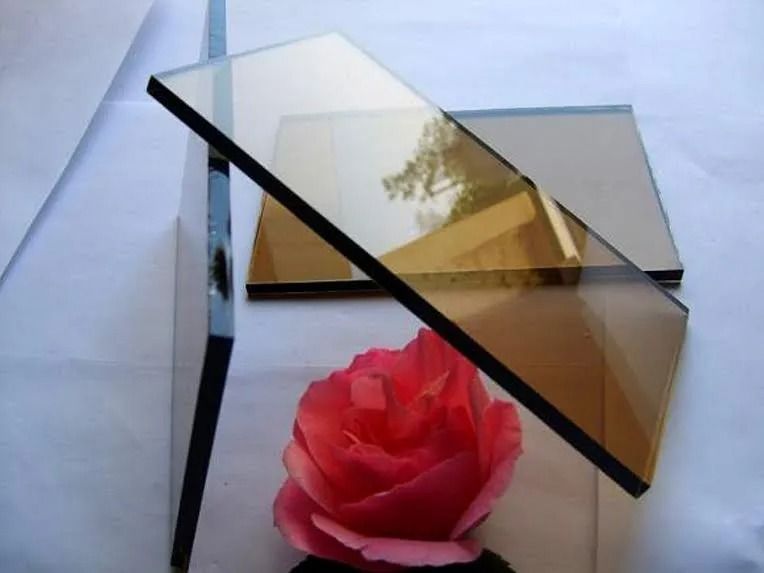 Brown tinted glass panels with a red rose.