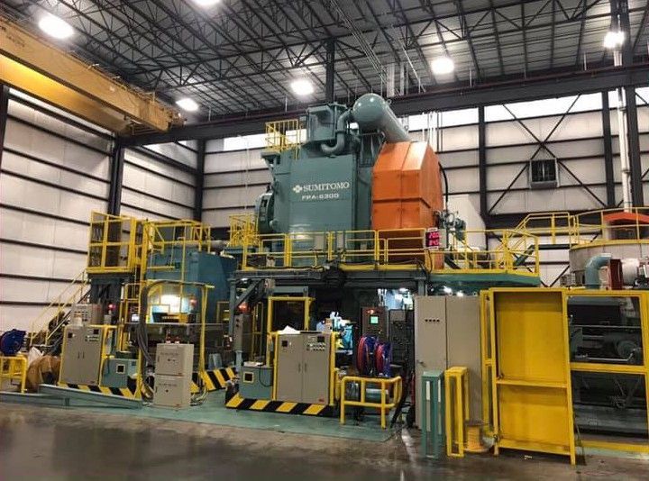 A large machine is sitting inside of a building.