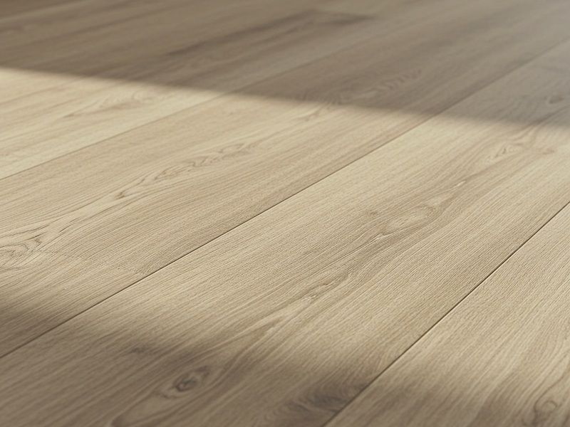 Light wood floor with sunlight casting diagonal shadows