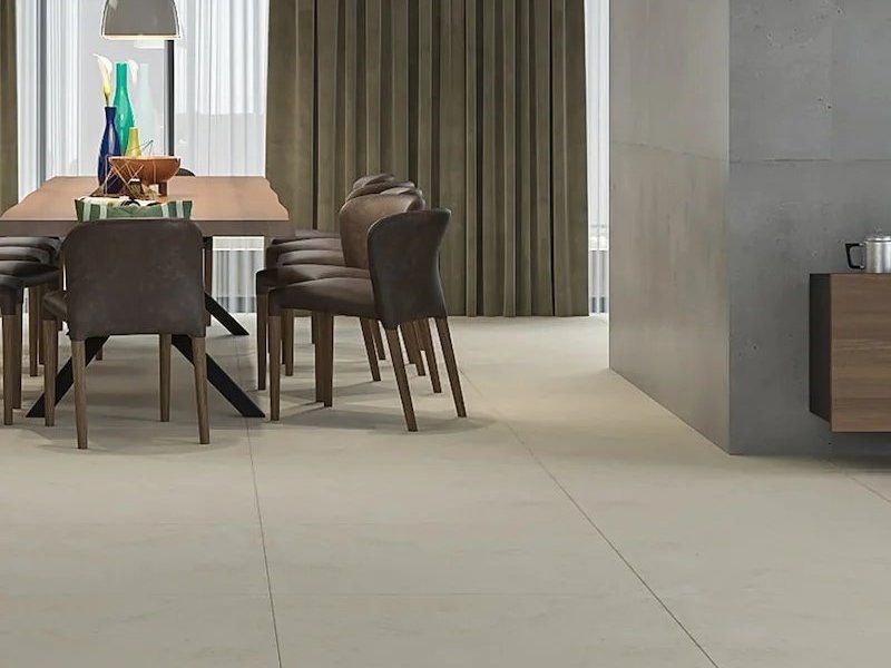 Modern dining area with a table, chairs, curtain, and beige tiled floor in a minimalist room