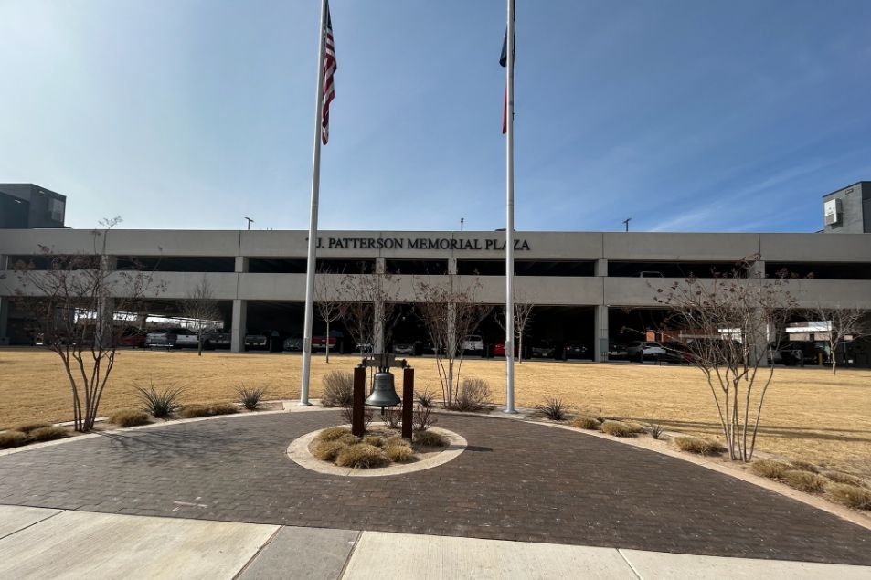 A large building with a flag flying in front of it.