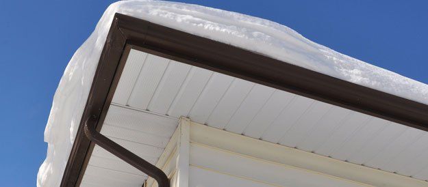 gutter with snow in the roof