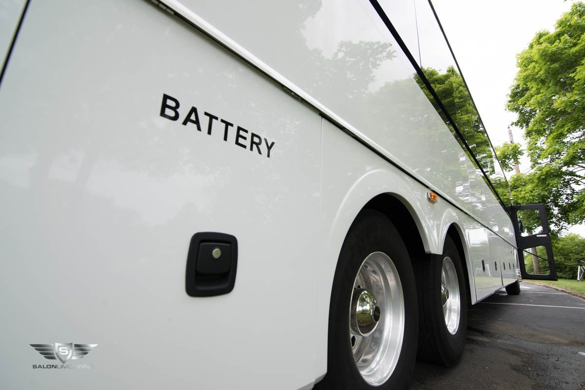 A white bus with the word battery on the side