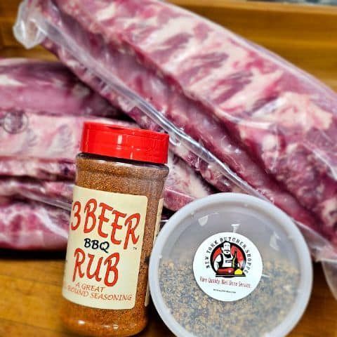 Ribs and spice rubs: raw meat packaged with two seasoning containers.