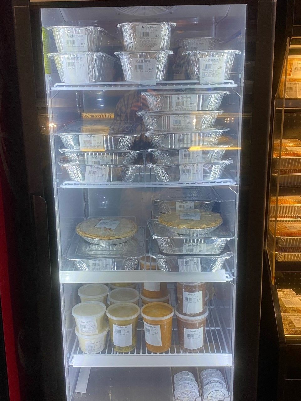 Refrigerator stocked with prepared meals