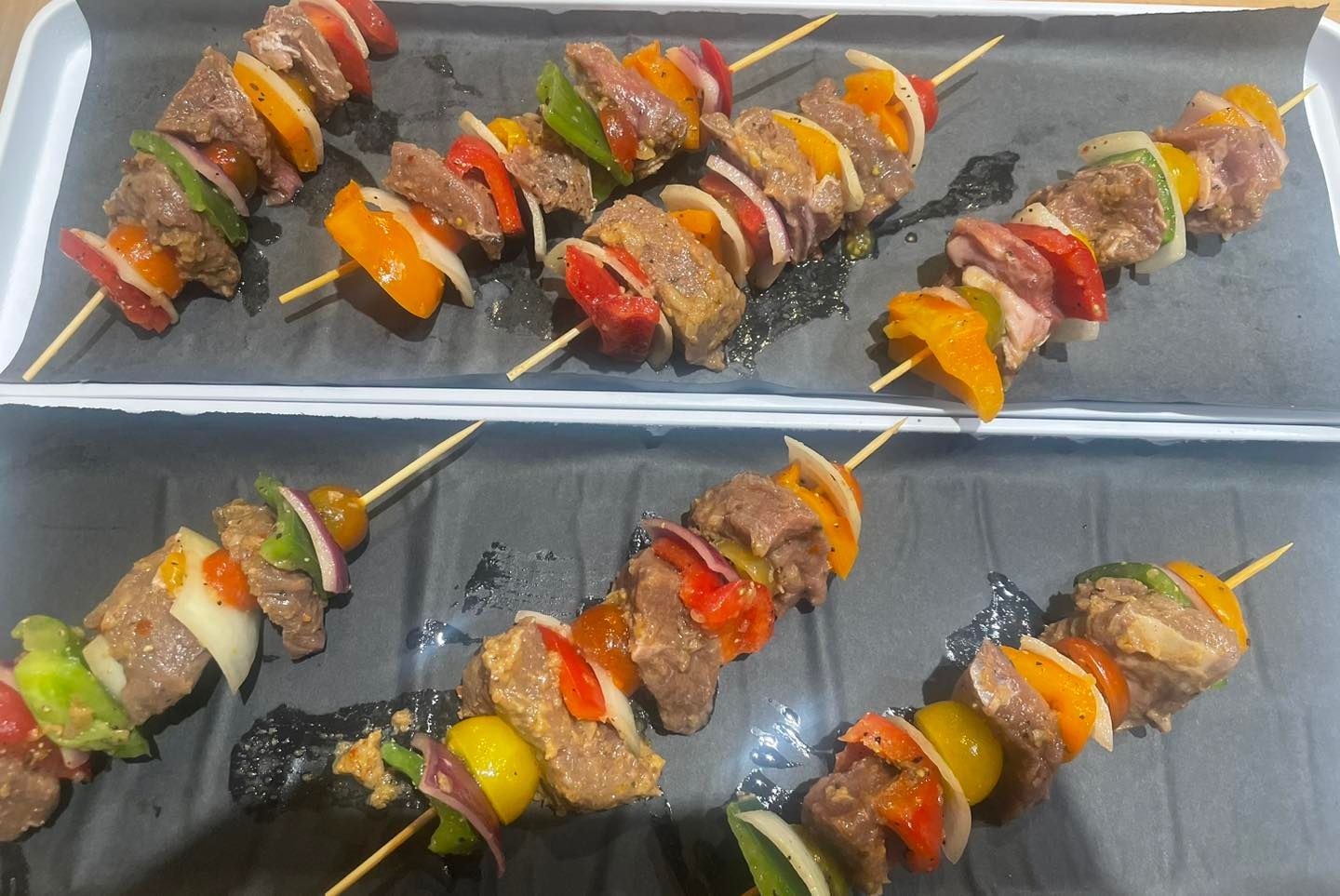 Kabobs with meat, peppers, and onions on skewers