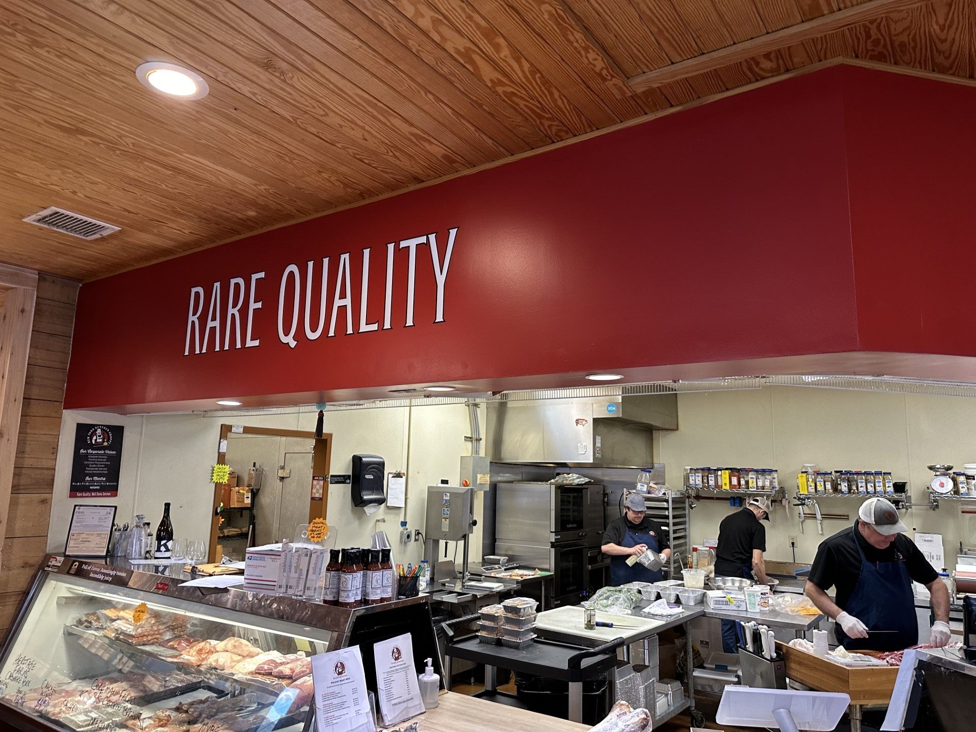 Three workers preparing food