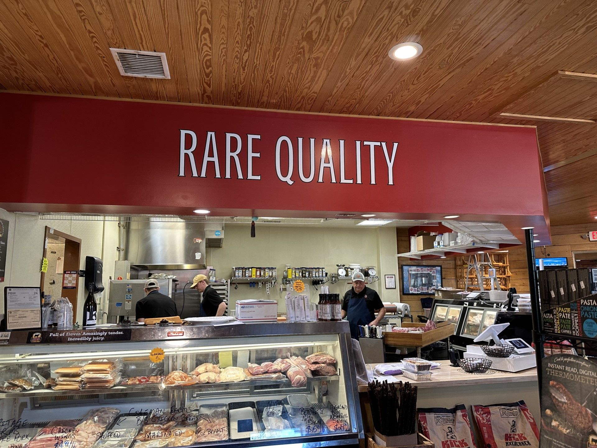 Three employees behind the counter