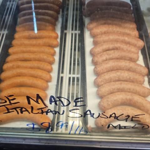 Display case with rows of homemade sausage