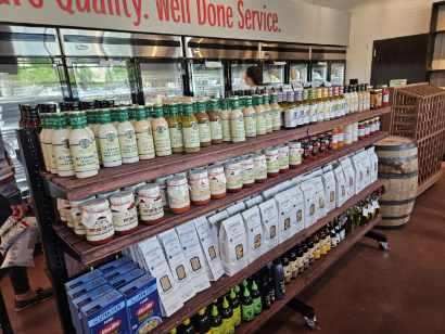 Shelves stocked with jars and bottles of food products