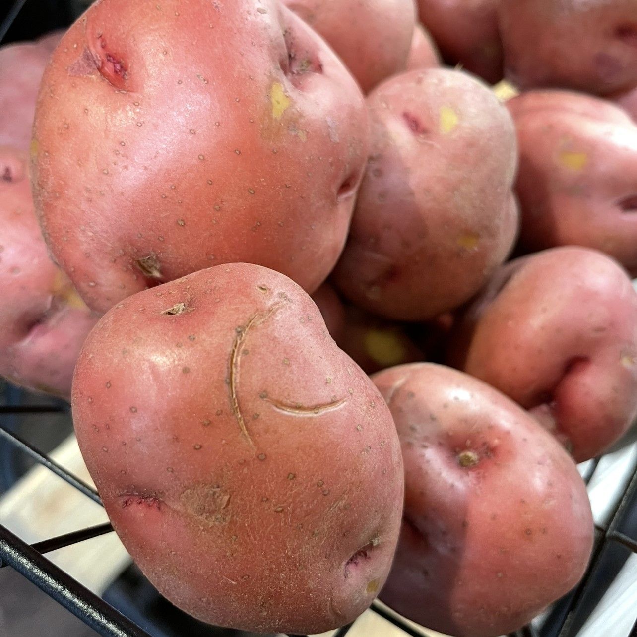 Red potatoes in a basket.