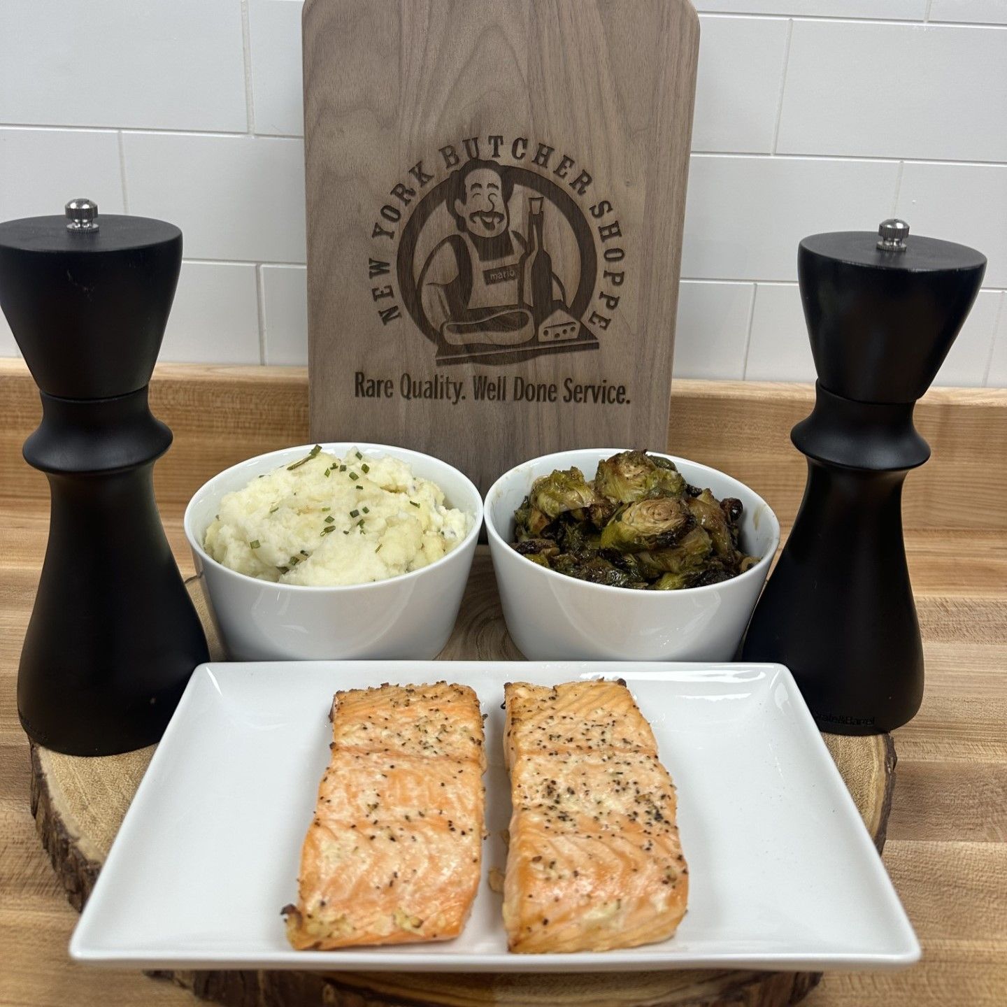 Grilled salmon fillets with mashed potatoes and Brussels sprouts.