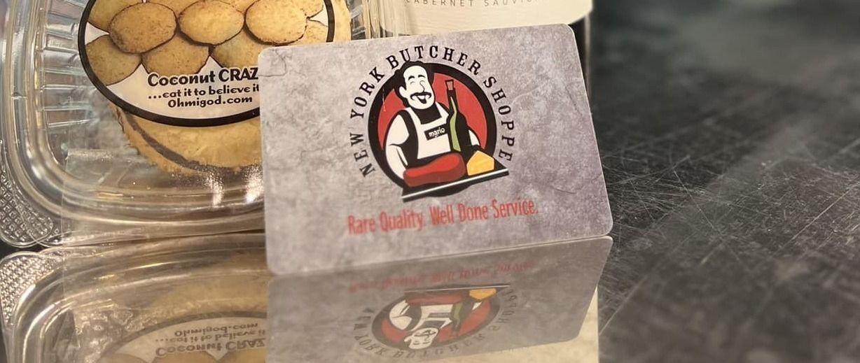 Business card for New York Butcher Shoppe, with logo of a man with apron and butcher knife.