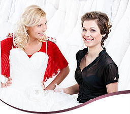 2 women trying on a wedding dress