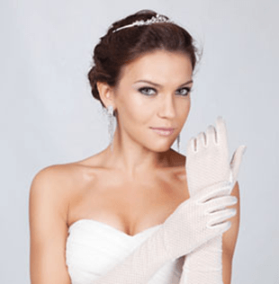 woman in wedding dress and white gloves