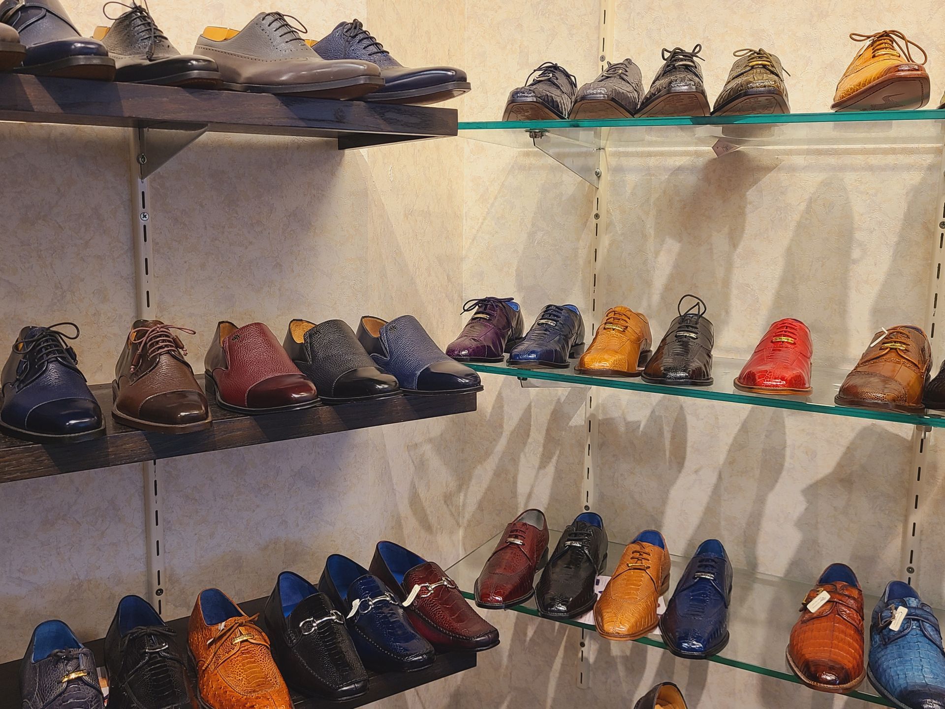 Shelves displaying assorted colorful shoes in a store