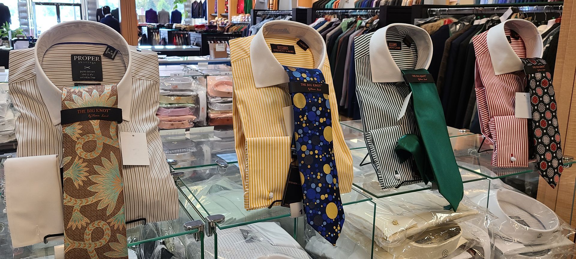 Display of patterned neckties on racks in a clothing store