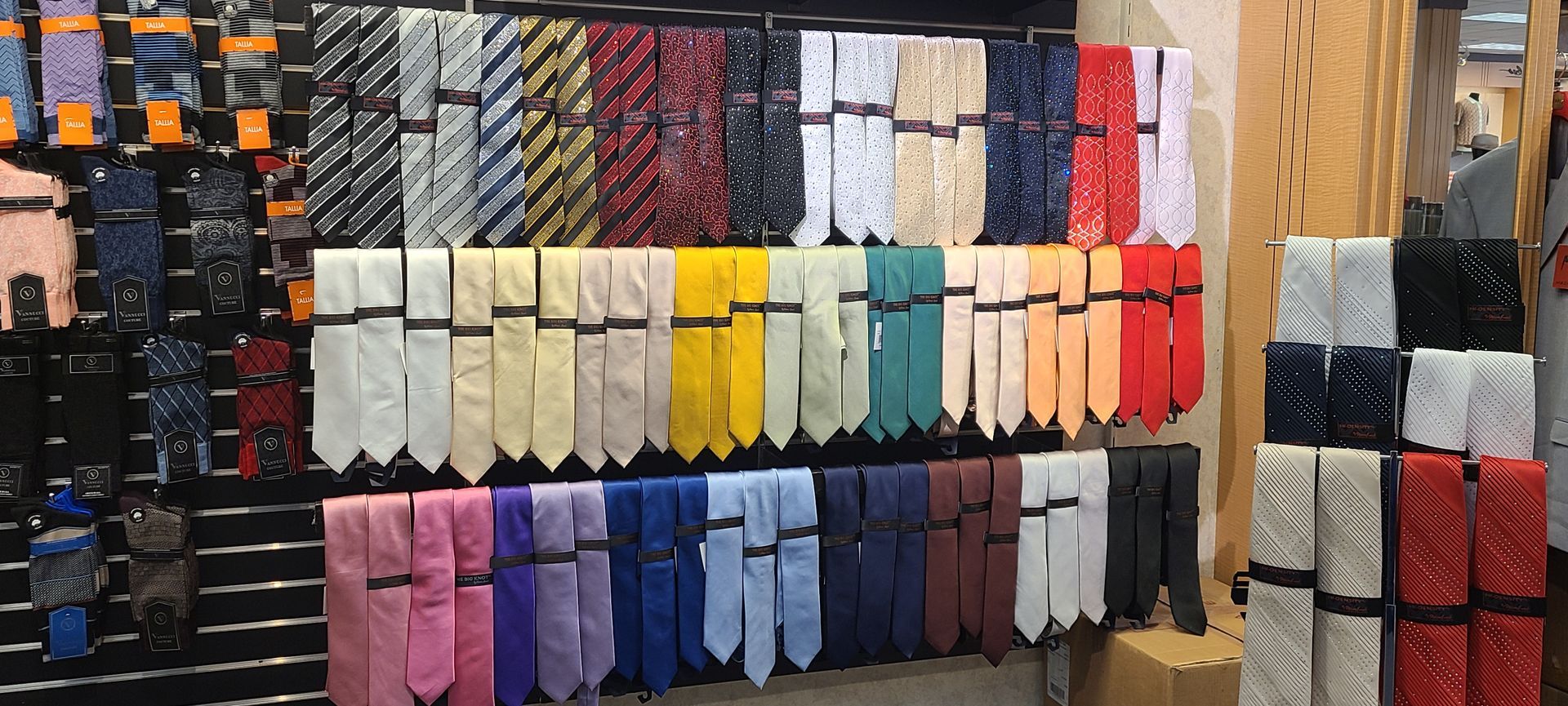 Rows of colorful folded socks displayed on shelves in a store