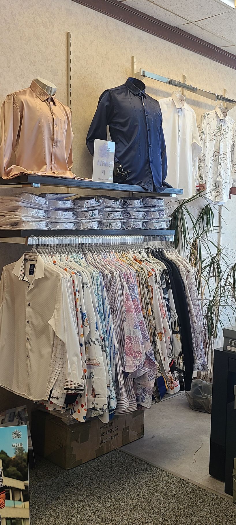 Clothing boutique with racks of patterned blouses and jackets on display