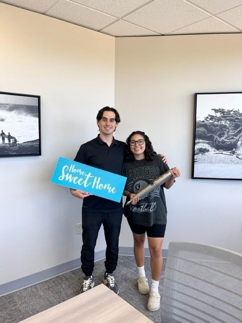 man and lady with sign