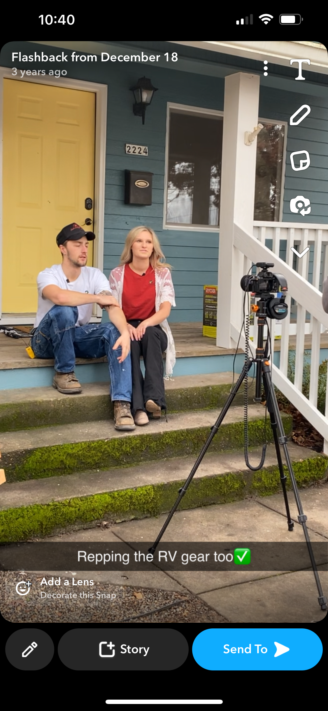 A man and a woman are sitting on the steps of a house