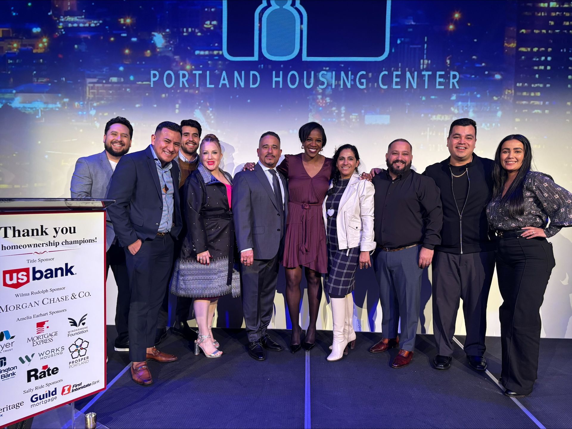 Group of people posing together at the Portland Housing Center event.