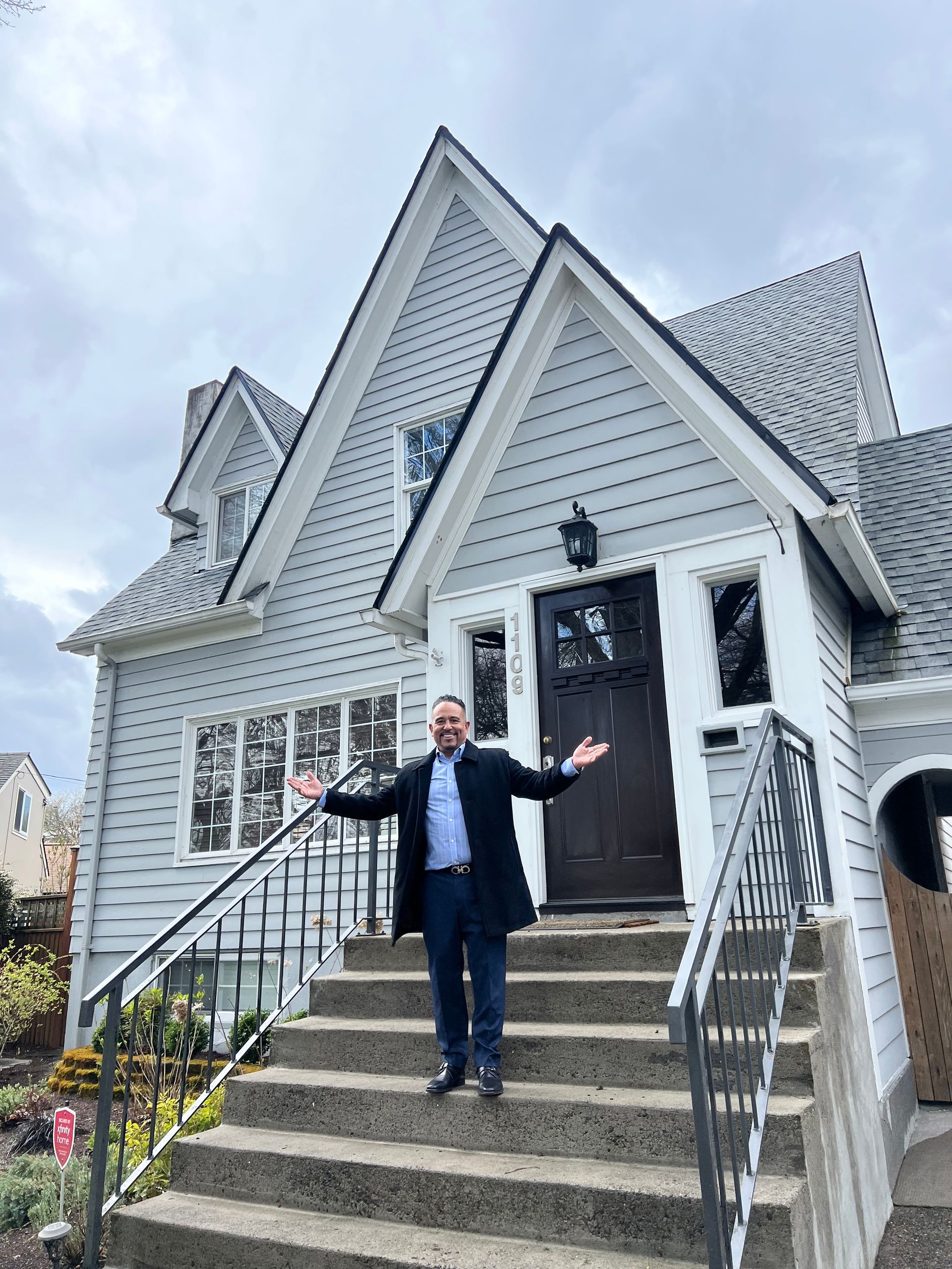 Man standing in front of a house