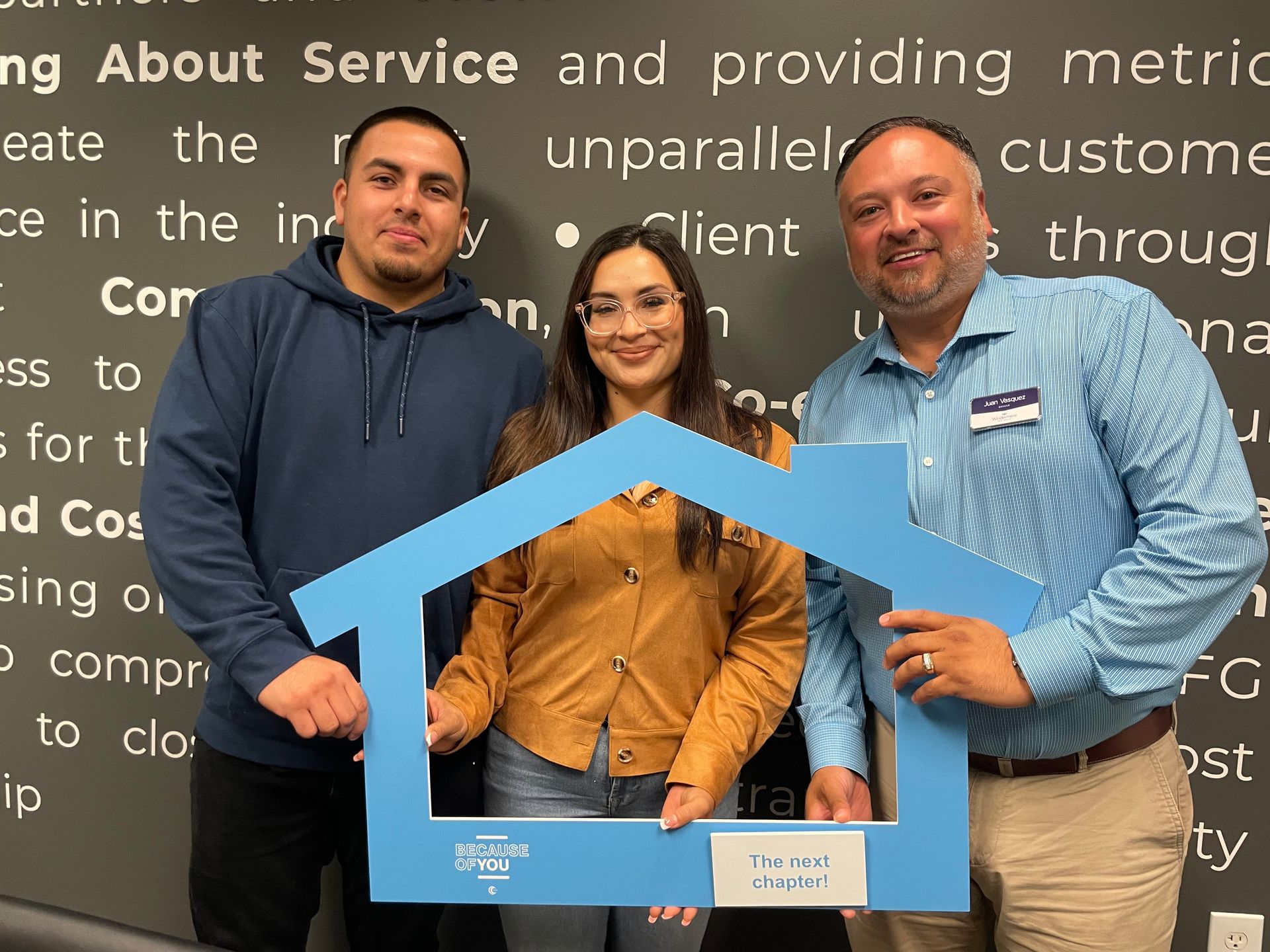 Rick Valdez with a big house board