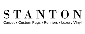 Stanton logo: Black sans-serif text STANTON over Carpet + Custom Rugs + Runners + Luxury Vinyl.