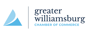 Logo of the Greater Williamsburg Chamber of Commerce. Blue and light blue abstract shape on left, text on right.