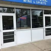 Exterior of a liquor store with a white door and 