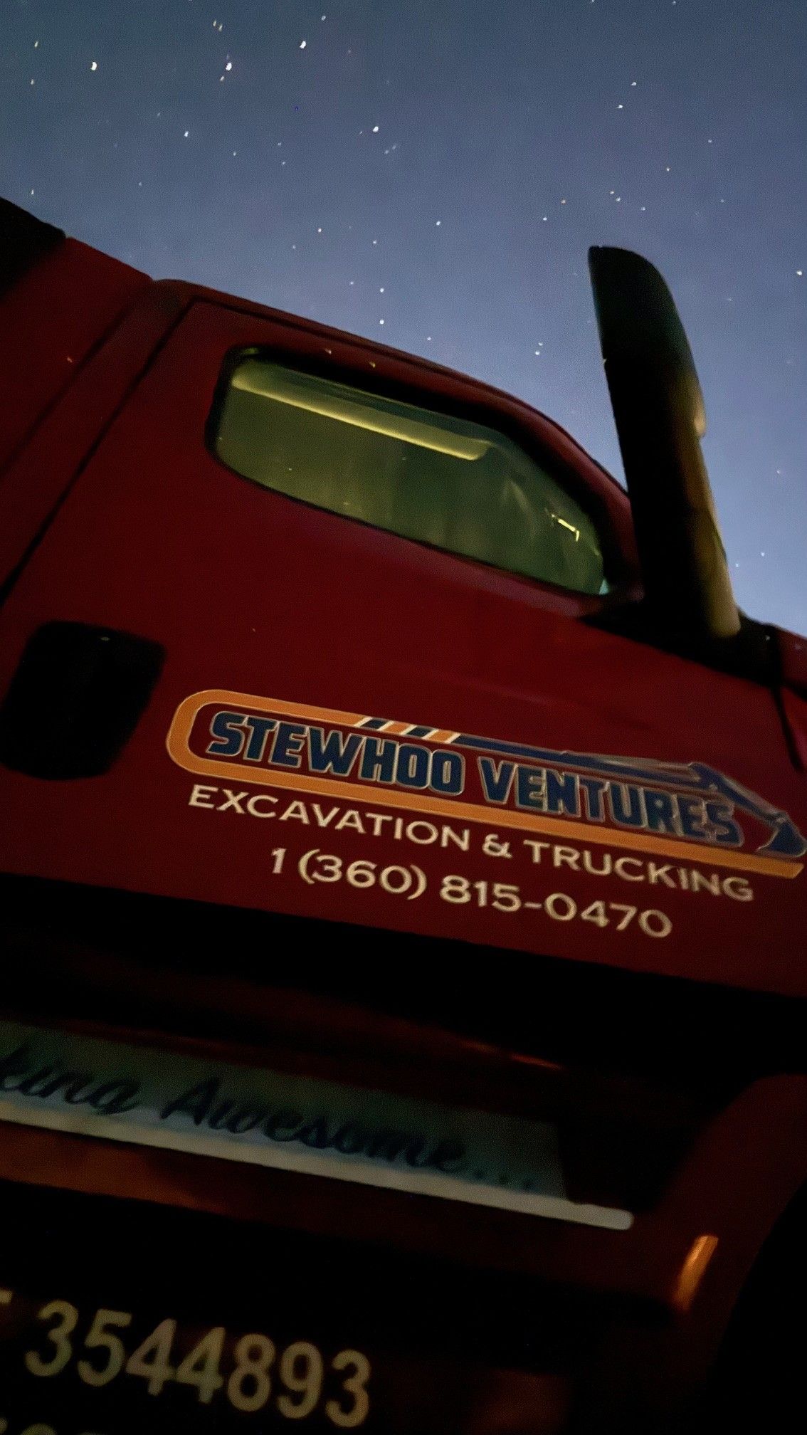 A red truck with the word excavation on it