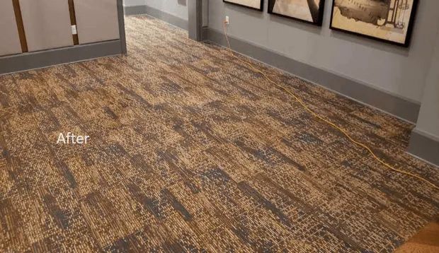 A hallway with a wooden floor and pictures on the wall